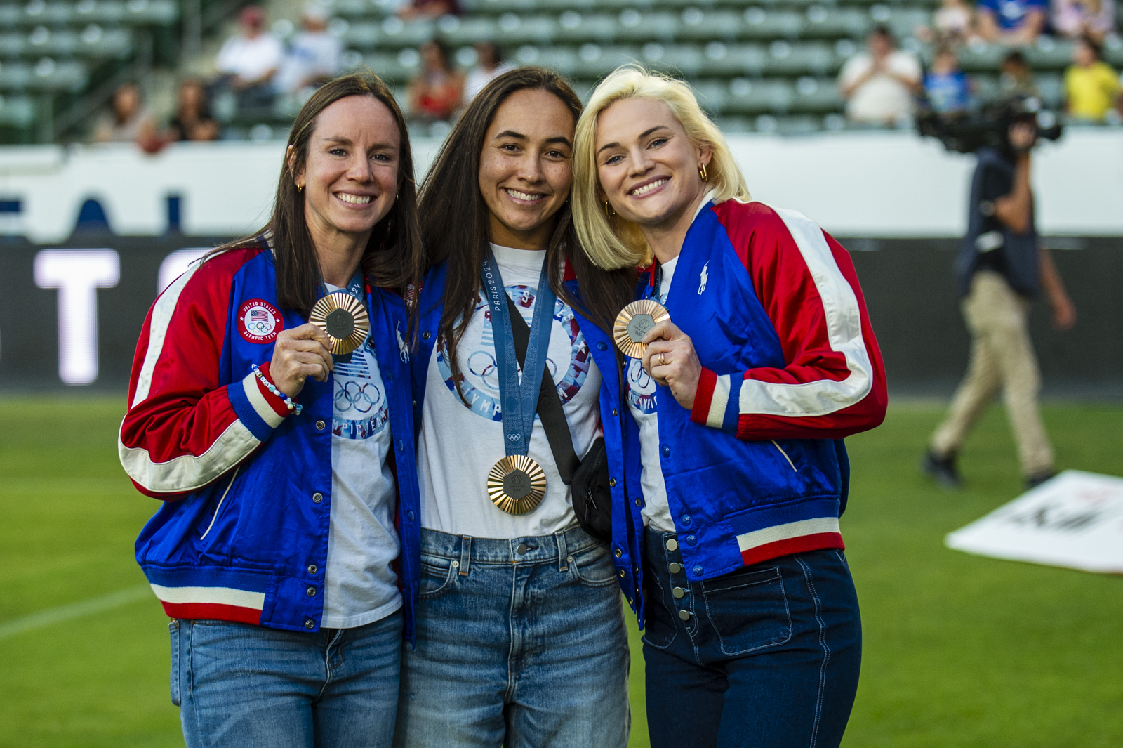 Stephanie Rovetti, Spiff Sedrick, and Sammy Sullivan show their bronze medals at the USA vs Canada match in 2024. David Barpal photo.