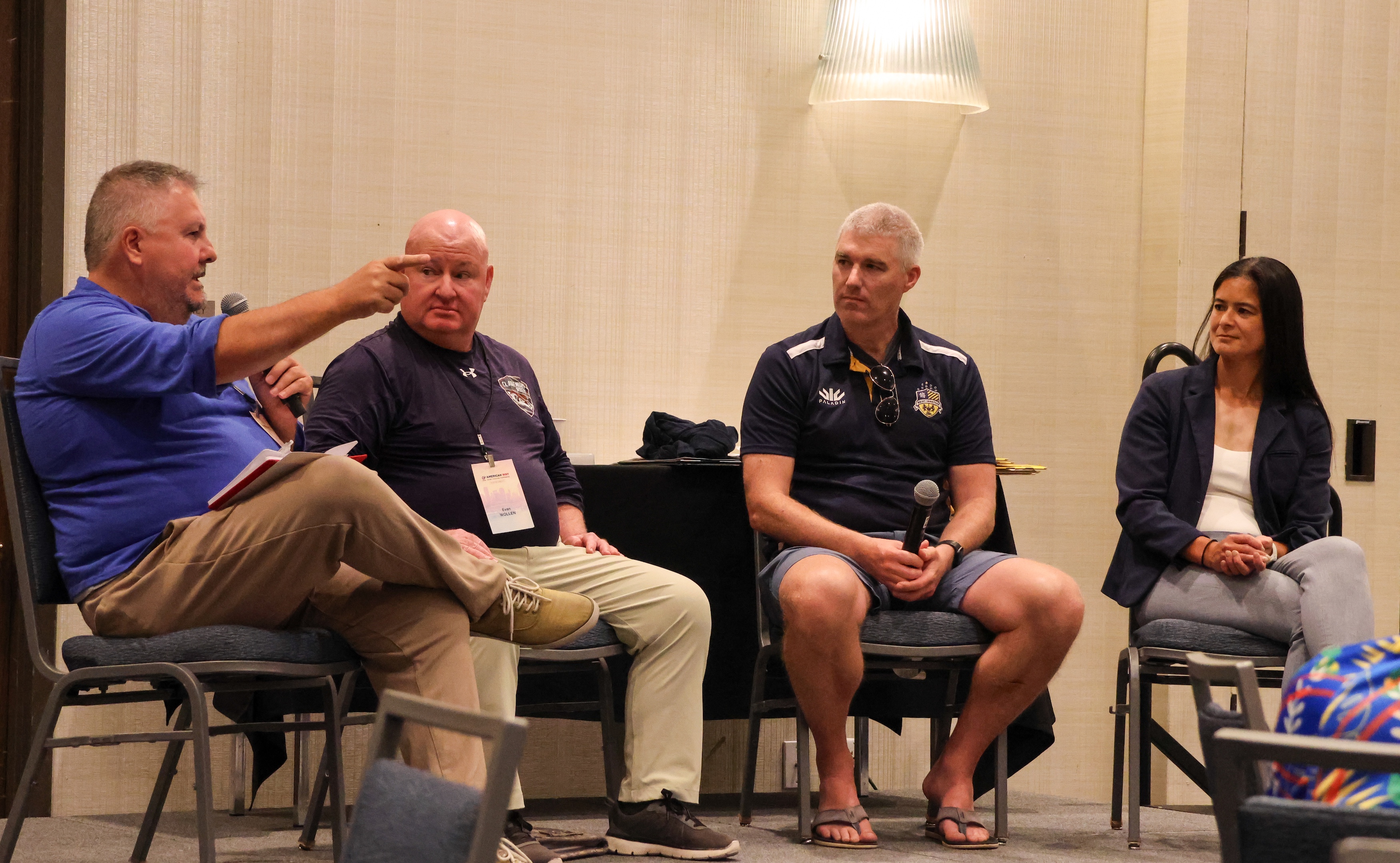 Alex Goff, Evan Wollen, Dan Arbeznik, and Irene Gardner in the Craft of Coach panel.
