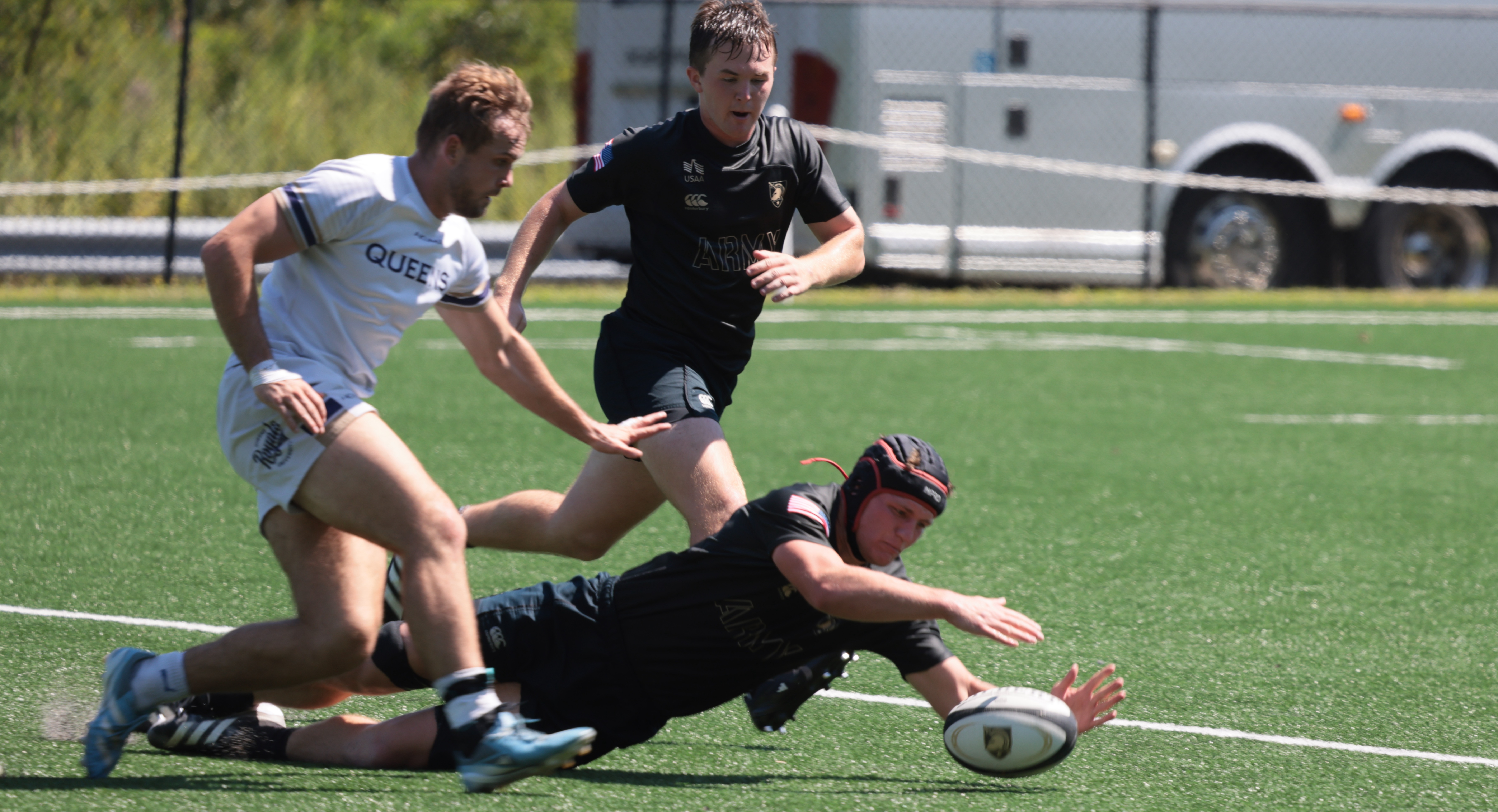 Max Doerfler dives on a ball for Army against Queens. Photo Walter Schmidlin.