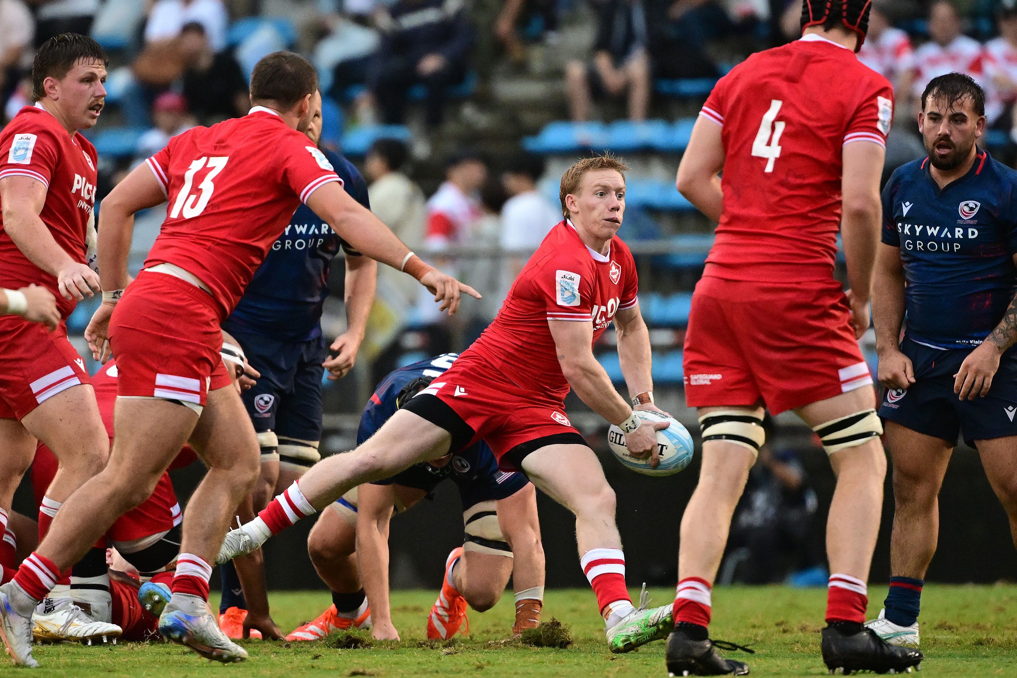 Jesse Kilgour sends the ball out for Canada. Kilgour would eventually score the game-winner. Photo Atsushi Tomura for World Rugby via Getty Images.