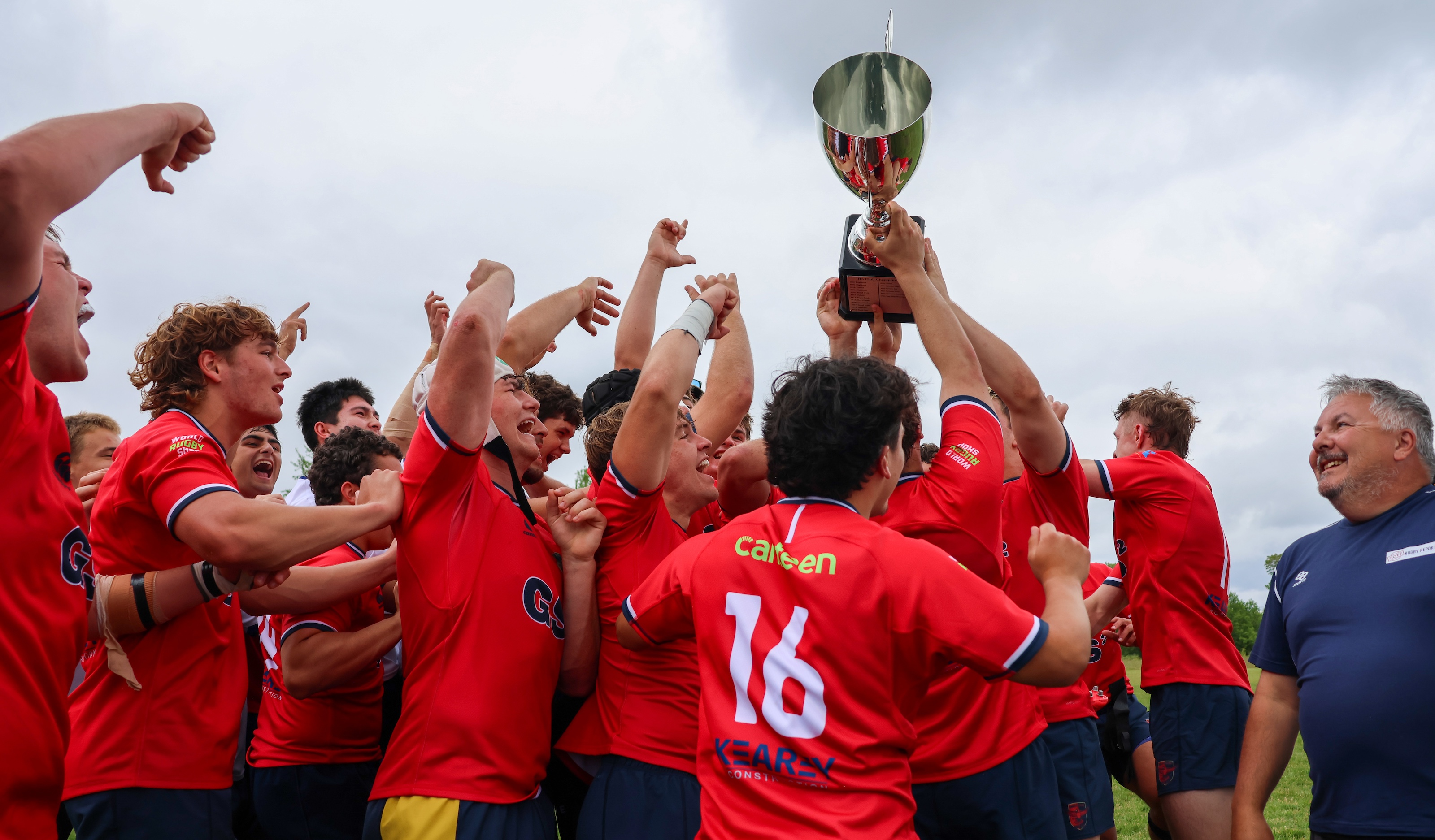 Charlotte Cardinals raise their trophy. Photo Calder Cahill.