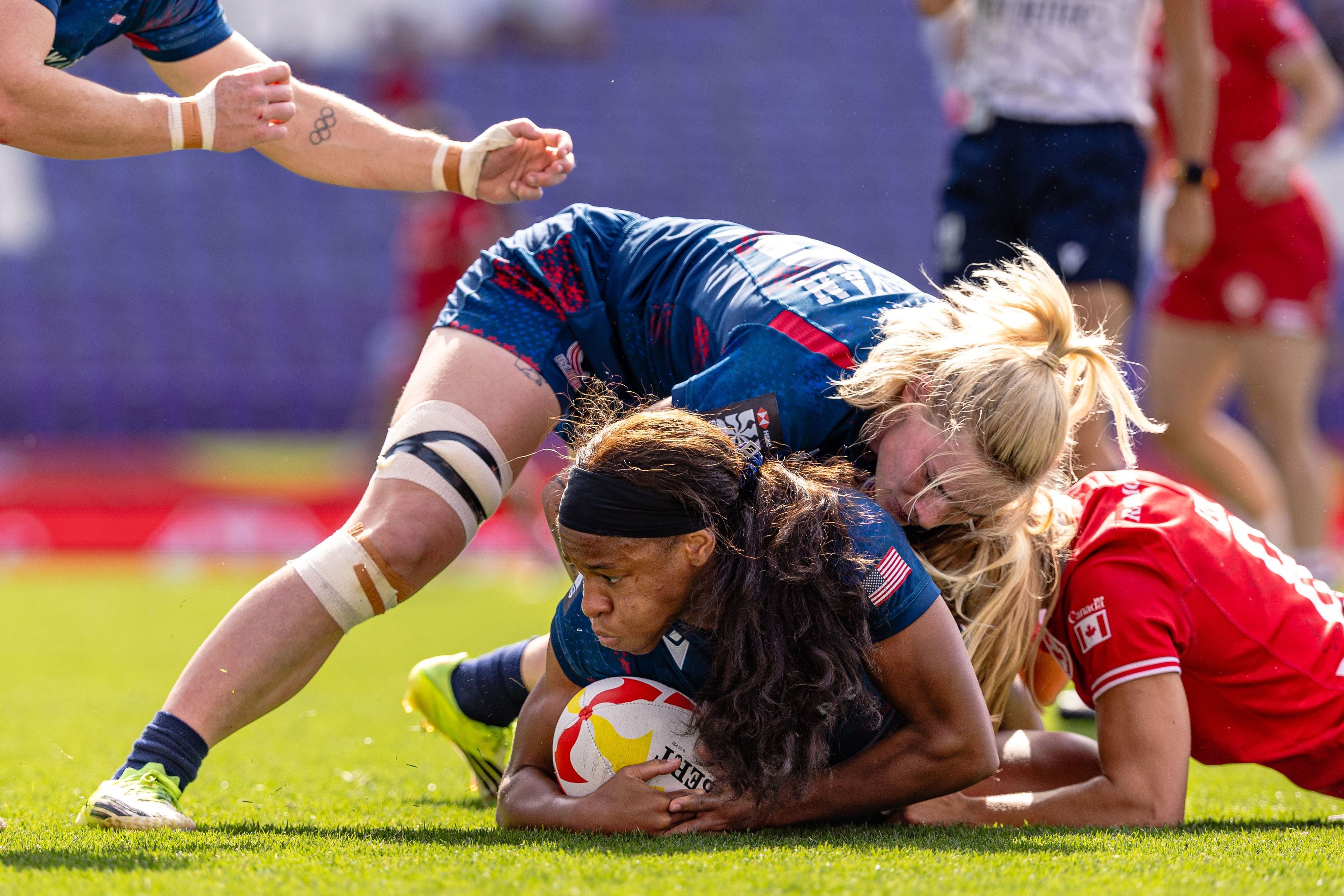Sam Sullivan helps Ariana Ramsey in the ruck against Canada. Photo Zach Freeman for World Rugby.