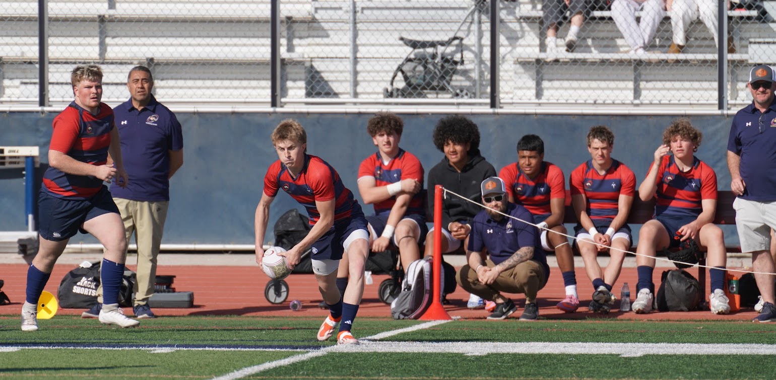 Boston Hales sends the ball out. Photo Rick Hales.