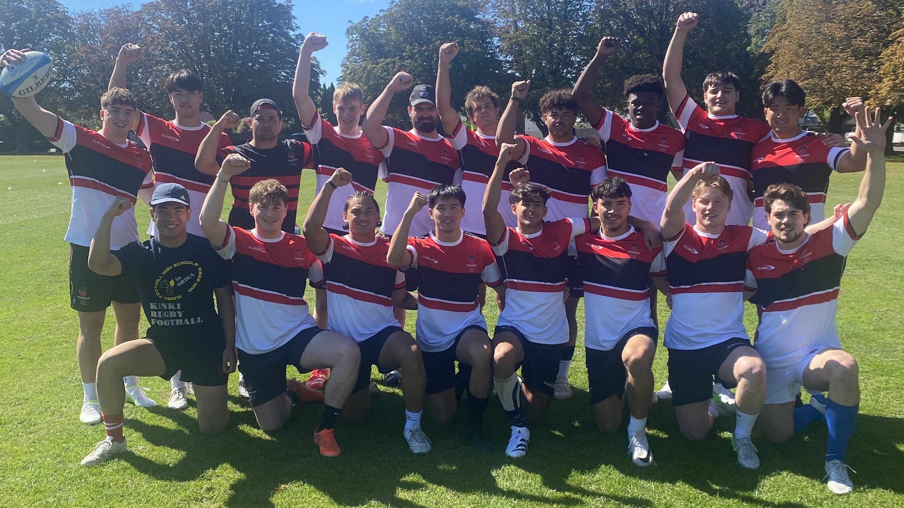 The Crusaders Global Academy group with Isaiah Lolesio-Pua.