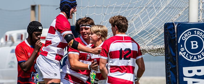 Dominic Peterson smiling, in headgear, after a try. Photo @gabryedsphoto.