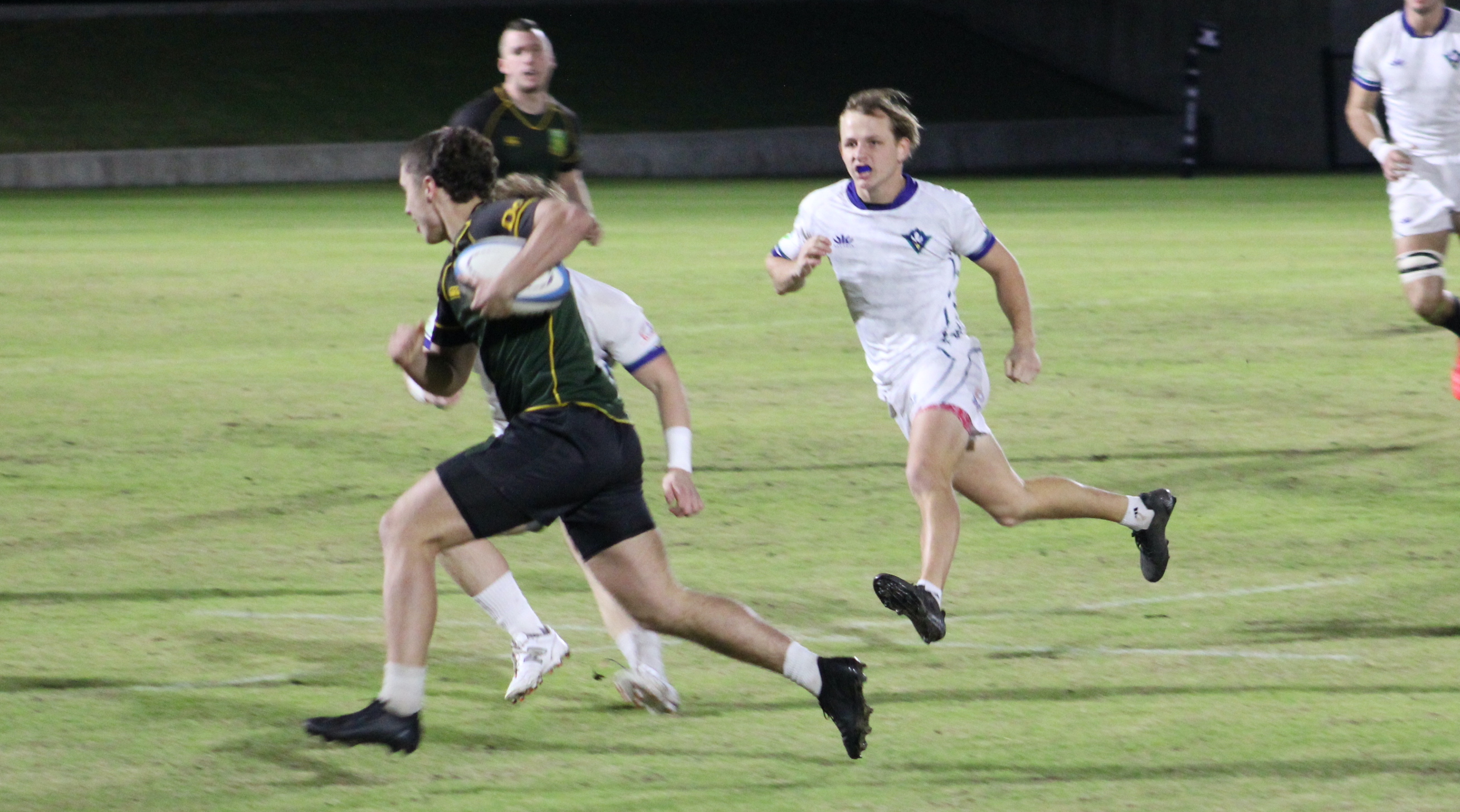 UNC Wilmington in white vs UVM in green in the 2025 NCR D2 semifinal. Photo Alex Goff.