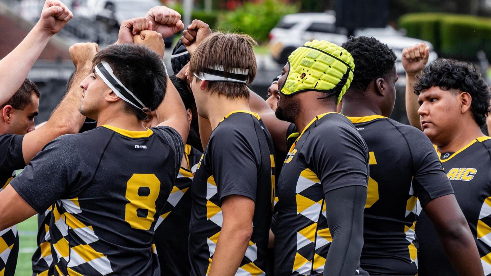 Brown vs AIC 2025. AIC Huddle. Photo Leon Nguyen.