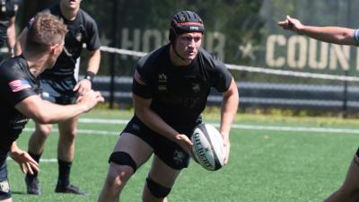 Max Doerfler takes the ball up for Army against Queens. Photo Walter Schmidlin.