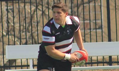 Jacob Ortiz passes the ball out for the Benedictine Black Monks.