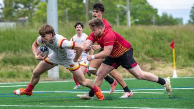 Iowa State, in white, won goes in for another try. Calder Cahill photo.