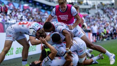 USA players celebrate beating Fiji in Bordeaux. Photo Alex Ho for World Rugby.