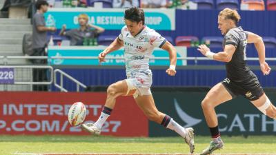 Lucas Lacamp chips ahead vs Germany in Hong Kong. Photo by Alex Ho / World Rugby.