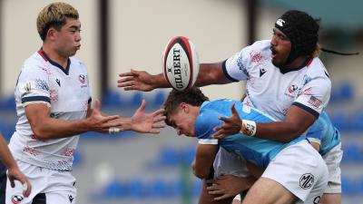 Papa Matelau offloads to Dane Mitchell vs Uruguay. Photo Giorgi Arjevanidze for World Rugby.