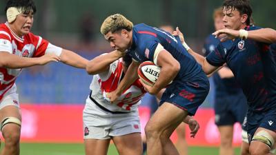 Dane Mitchell works his way through the Japan defense. Photo Levan Verzeuli for World Rugby.