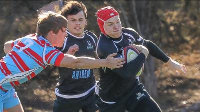 Kai Campbell charges ahead for Huskies.