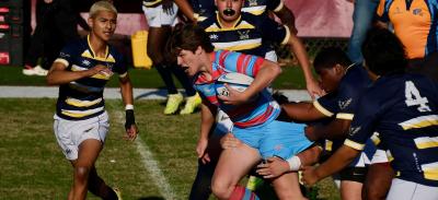 Miles Caple carries the ball for Charlotte Catholic.