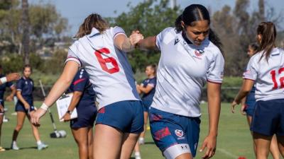 Abbey McGettigan and Luisa Moala stretch out at U18 camp.