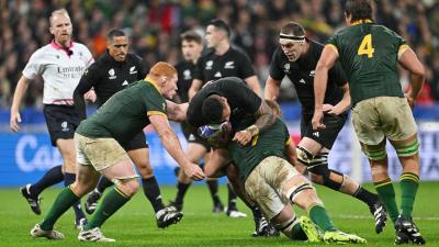 Shannon Frizell of New Zealand is tackled by Pieter-Steph Du Toit of South Africa during the 2023 Rugby World Cup Final at Stade de France Oct. 28, 2023. Photo by David Ramos - World Rugby/World Rugby via Getty Images.
