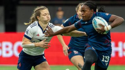 Kayen Thomas fends off some French attention. Photo Alex Ho.