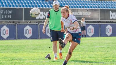 Annie Henrich slots the conversion while Jack Hanratty looks on. Photo South Africa Rugby.