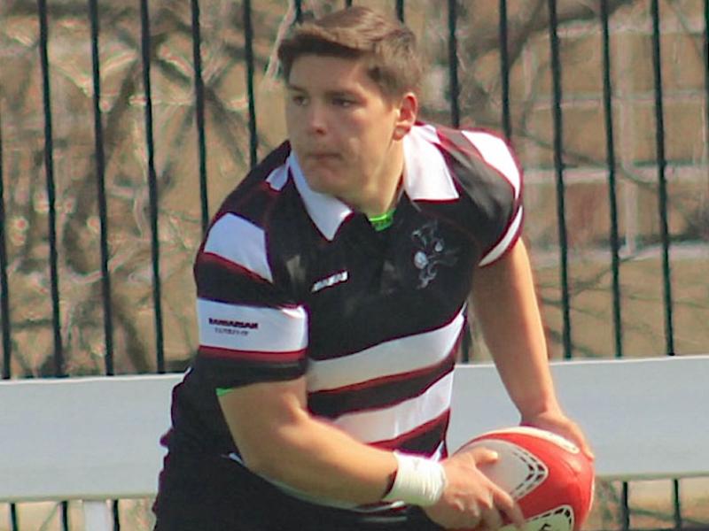Jacob Ortiz passes the ball out for the Benedictine Black Monks.