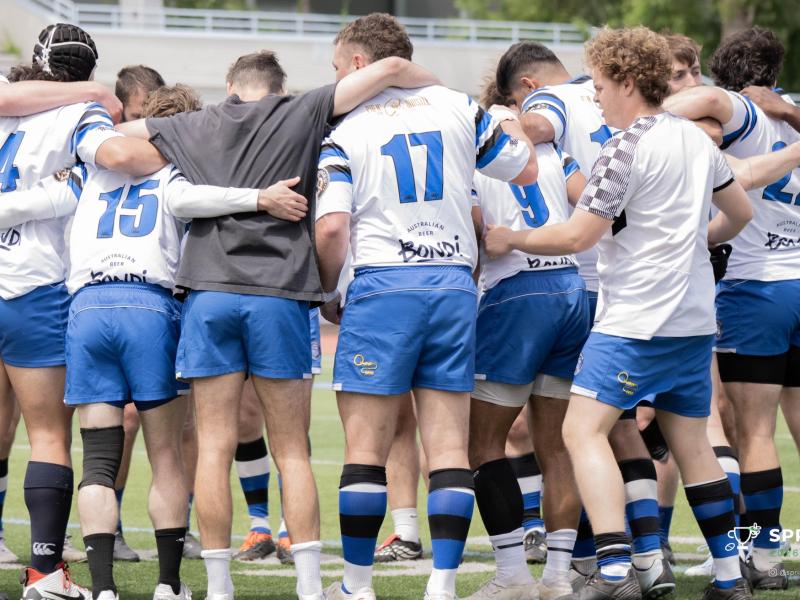 Brooklyn Rugby huddles up. Photo Spring Cup Rugby.