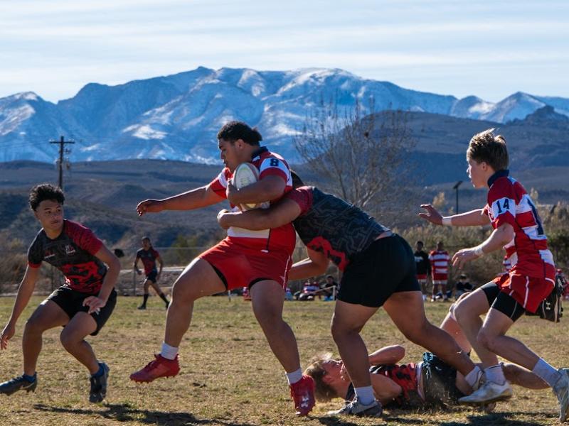 Cavemen makes a tackle against East HS. Photo Maxwell Brent @brentography.