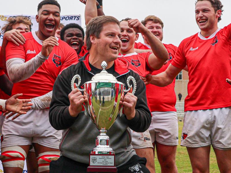 Dominic Shaw hoists the Spartan Regiment Bowl trophy in 2025. Photo Calder Cahill.
