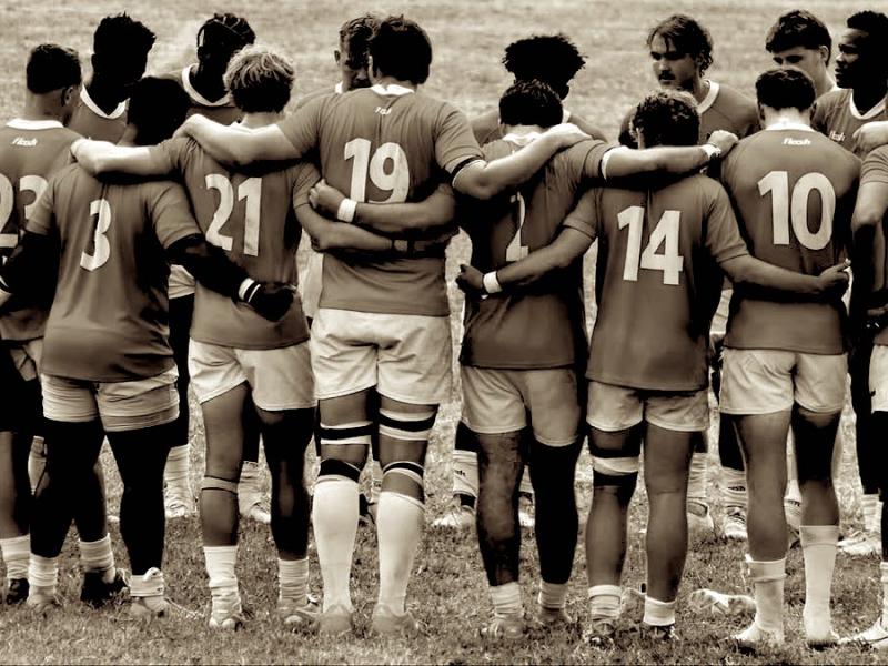 A college team huddles up.