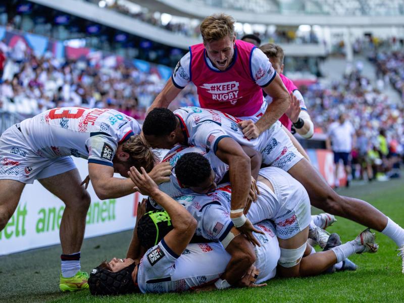 USA players celebrate beating Fiji in Bordeaux. Photo Alex Ho for World Rugby.