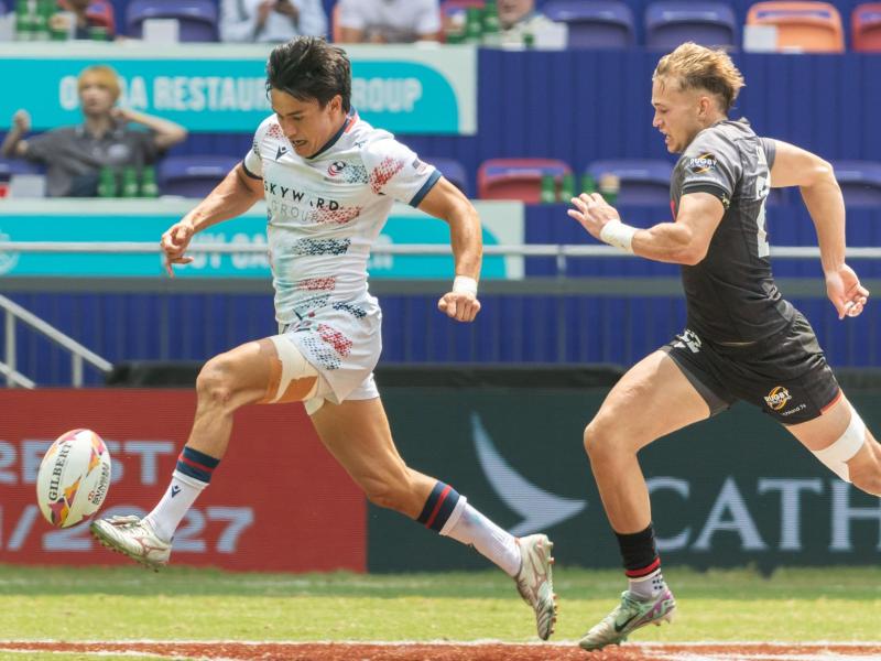 Lucas Lacamp chips ahead vs Germany. Photo Alex Ho for World Rugby.