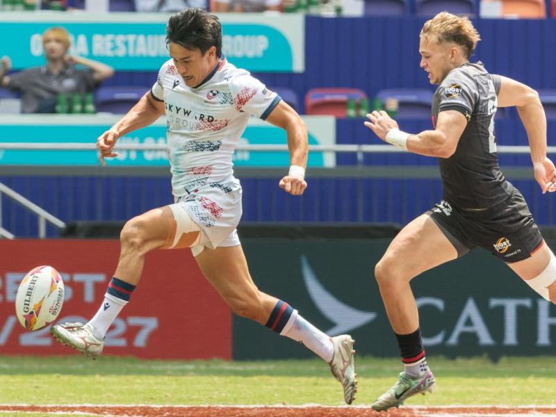 Lucas Lacamp chips ahead vs Germany in Hong Kong. Photo by Alex Ho / World Rugby.