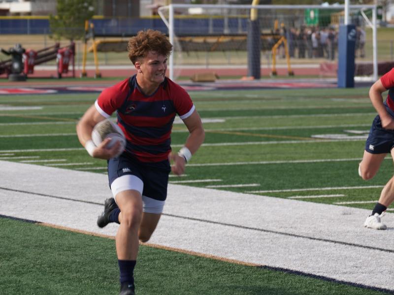 Max Wilson down the sideline. Photo Rick Hales.