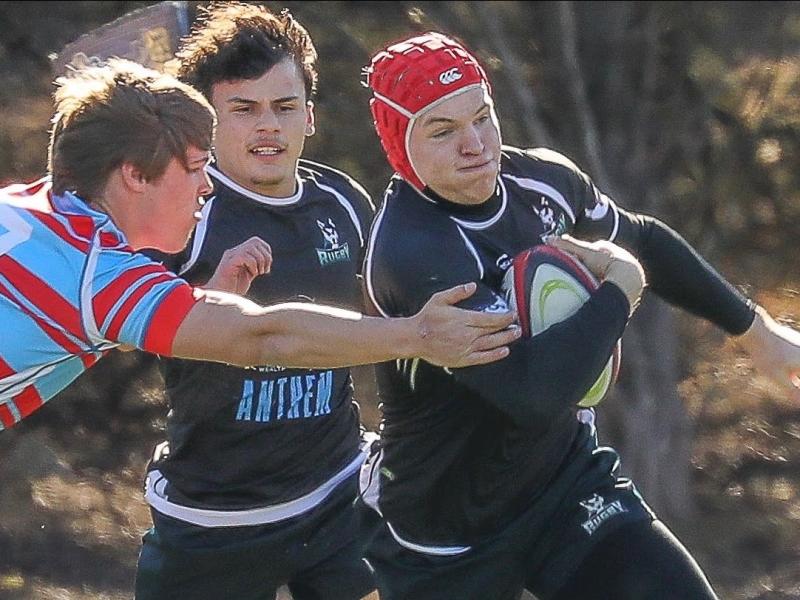 Kai Campbell charges ahead for Huskies.