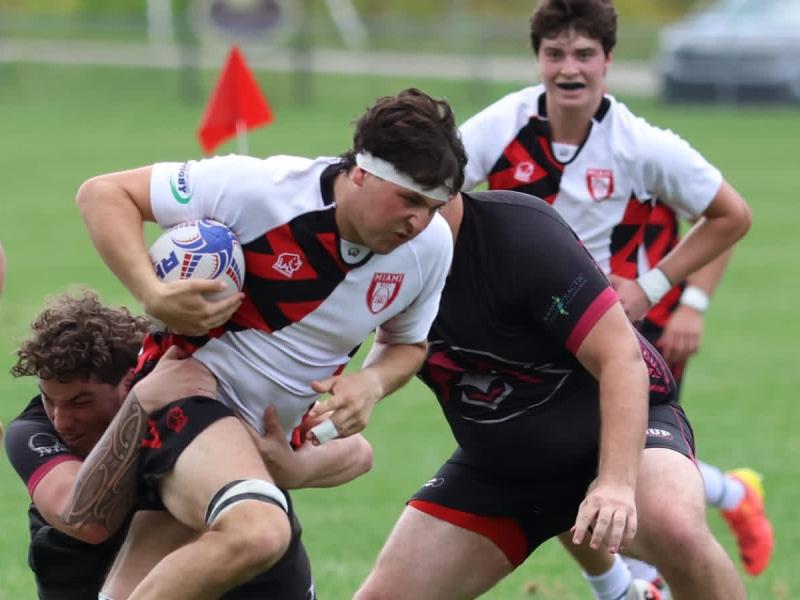 Oliver Seitchik charges through contact for Miami. Photo Kaileigh Hennard.