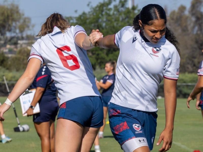 Abbey McGettigan and Luisa Moala stretch out at U18 camp.