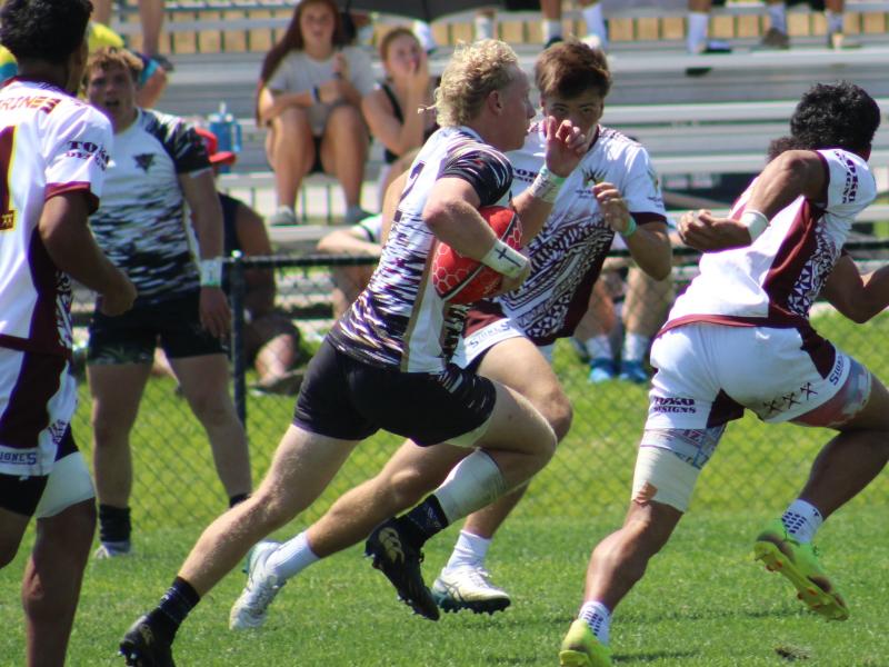 Blake Guthrie goes in for the game-winner for Rebel at the NAI 7s. Photo Alex Goff