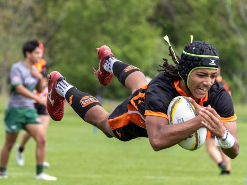 Nehemiah Gill Jr. soars in for a try for the Charlotte Tigers. Photo Calder Cahill.