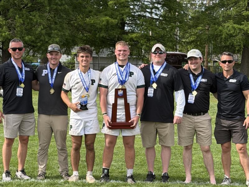 Pendleton captains and coaches with their trophy.