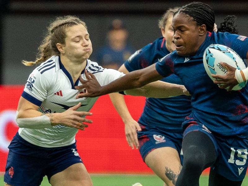 Kayen Thomas fends off some French attention. Photo Alex Ho.