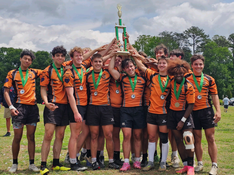Charlotte Tigers hoist their 2026 North Carolina Club trophy.