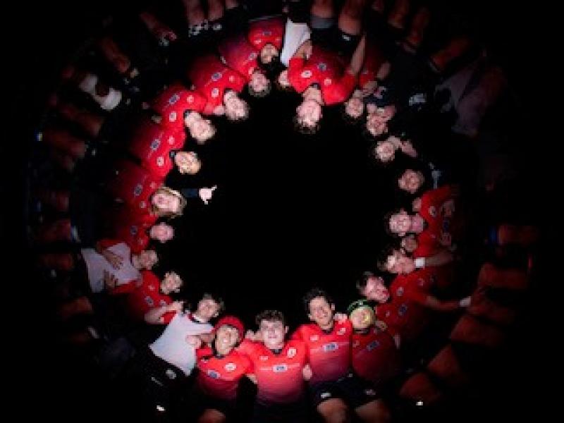 Tritons assemble at halfime.