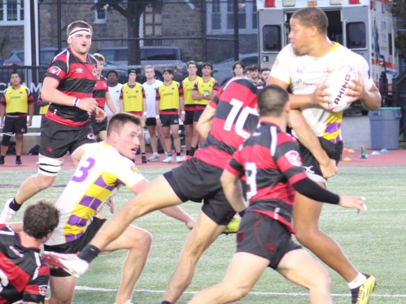 West Chester's Elisha Ross looks to offload to Aidan Malley. Both made the list. Alex Goff photo.