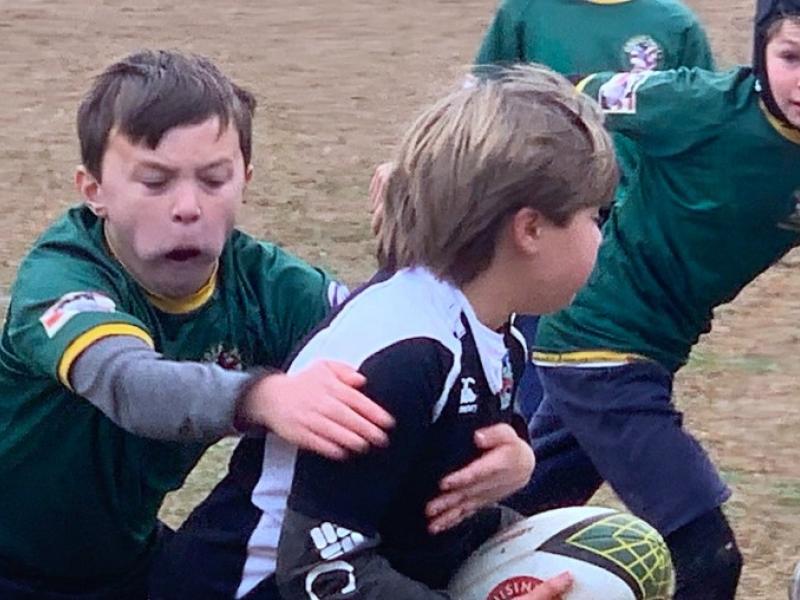 jack hooper of great falls u13s tackles with artus justeau in support