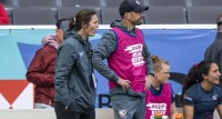 Emilie Bydwell with Zach Test on the sidelines at the LA 7s. David Barpal photo.