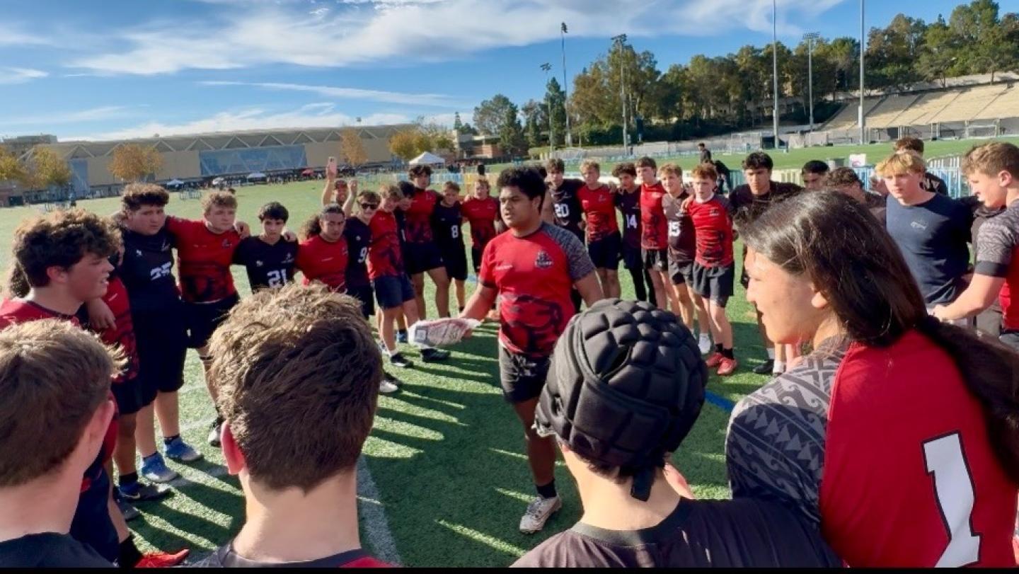 Cavemen bond with their opponents at the 2026 Storer Classic.
