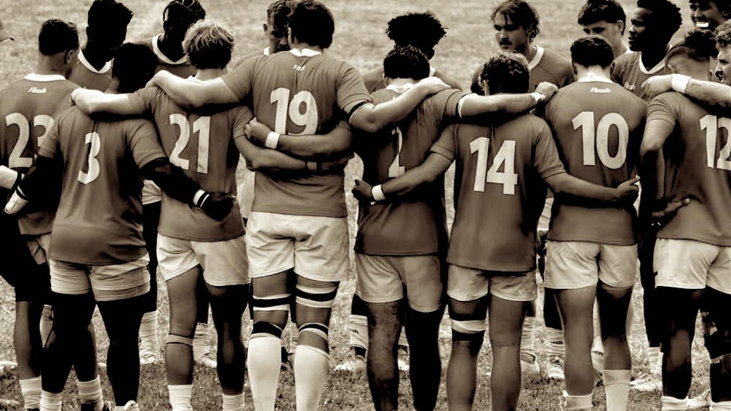 A college team huddles up.