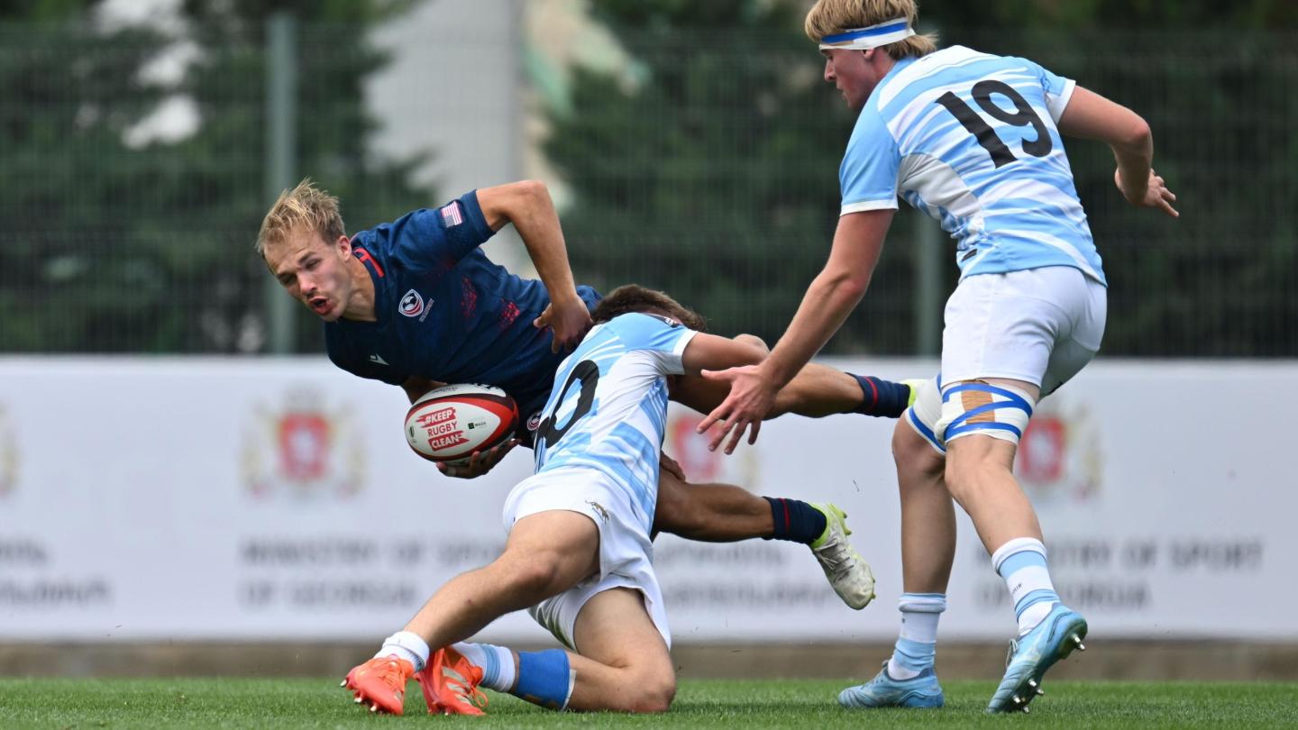 Gavin Holder gets some attention from the Argentina U20 defenders. Photo Levan Verdzeuli for World Rugby.
