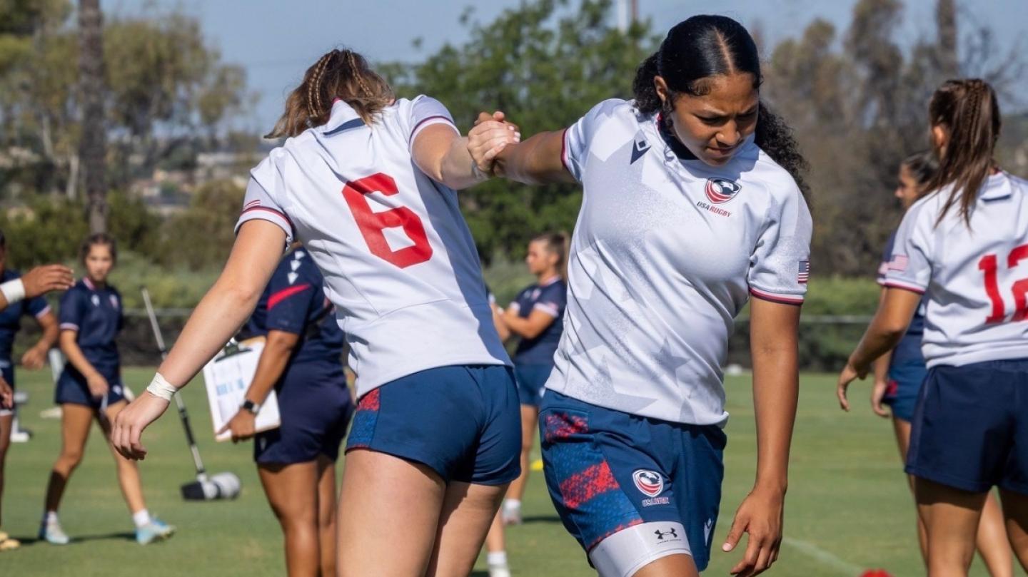 Abbey McGettigan and Luisa Moala stretch out at U18 camp.