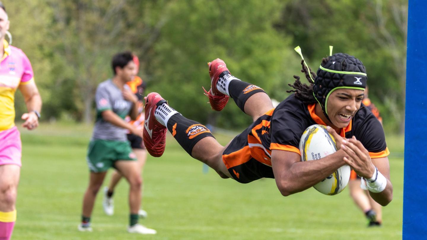 Nehemiah Gill Jr. soars in for a try for the Charlotte Tigers. Photo Calder Cahill.